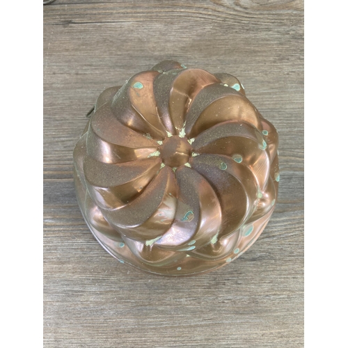 302 - Five vintage copper cake/jelly moulds