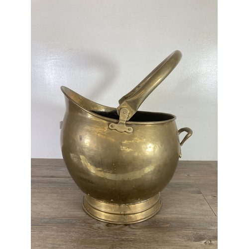 303 - A 19th century brass coal scuttle - approx. 34cm high