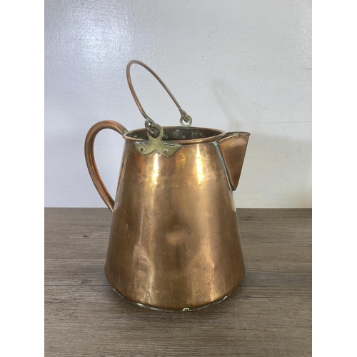 311 - Three pieces of 19th century copper and brassware, copper kettle with acorn finial, copper water jug... 