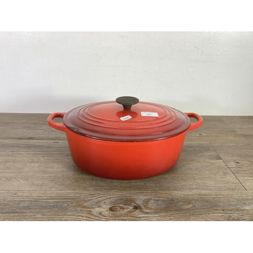 312 - A Le Creuset cast iron and enamel casserole dish