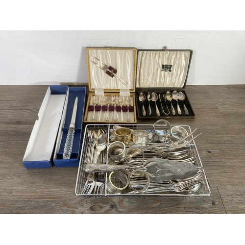 317 - A collection of metalware to include eight Mayell EP on Zinc napkin holders, Viners cutlery, cased s... 