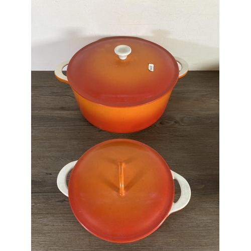 318 - Four Descoware cast iron and enamel graduating casserole dishes