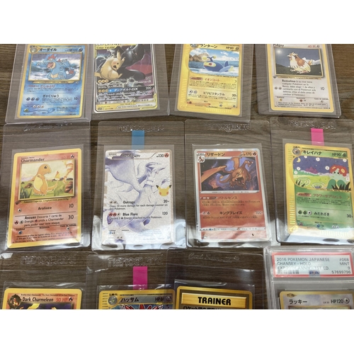 332 - A collection of Pokémon trading cards to include 2016 Japanese Expansion 20th Anniversary 1st Editio... 