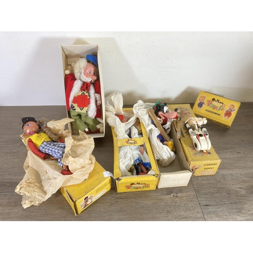 335 - Six vintage boxed Pelham Puppets Ltd. puppets to include SL King, Dutch Girl, Muffin, Goofy etc.