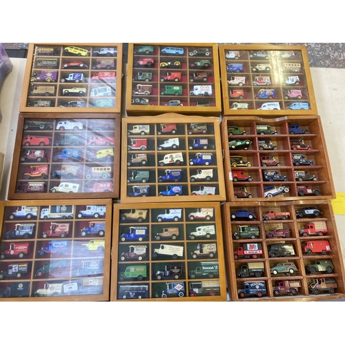 339 - Nine hardwood display cases containing a large collection of various diecast model vehicles