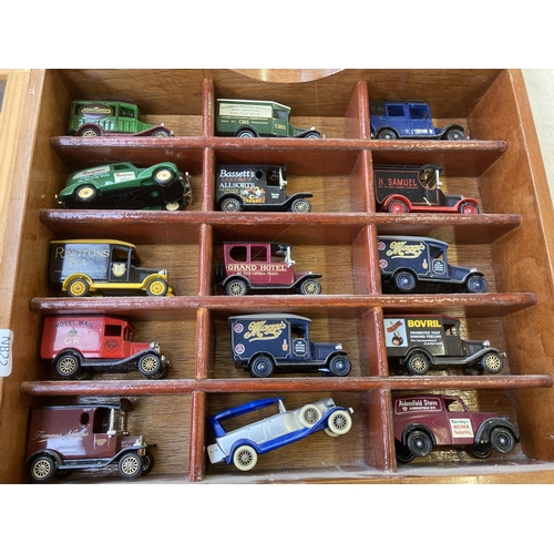 339 - Nine hardwood display cases containing a large collection of various diecast model vehicles