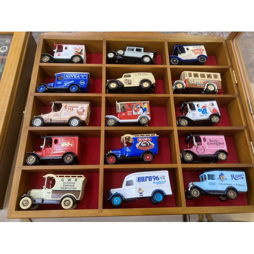 339 - Nine hardwood display cases containing a large collection of various diecast model vehicles