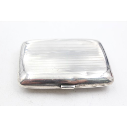 1231 - A George V hallmarked Birmingham silver cigarette case, dated 1919 - approx. gross weight 79 grams a... 