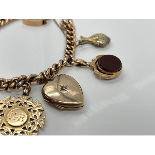 1119 - A late 19th/early 20th century 9ct gold bracelet with 9ct gold heart shaped padlock clasp and seven ... 