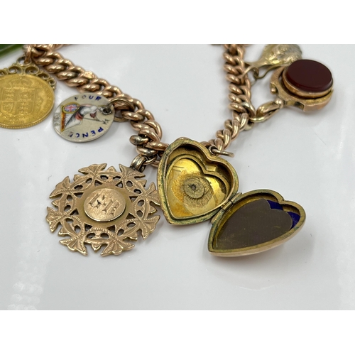 1119 - A late 19th/early 20th century 9ct gold bracelet with 9ct gold heart shaped padlock clasp and seven ... 