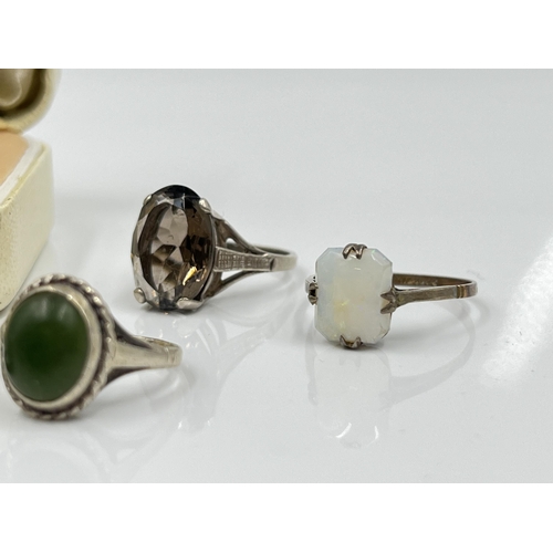 1140 - Nine sterling silver rings to include 9ct and silver opal, abalone etc.