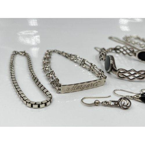 1154 - Seven pieces of sterling silver jewellery to include black onyx panel bracelet etc. - approx. gross ... 