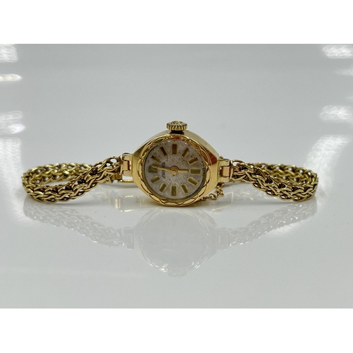 1197 - A 1930s Enicar 9ct gold cased mechanical lady's wristwatch with 9ct gold bracelet, watch dated 1936 ... 