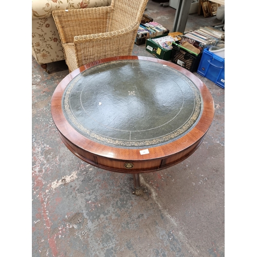 158 - A Regency style mahogany drum table with green leather insert and brass lion paw supports - approx. ... 