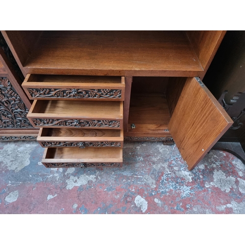 45B - A carved oak cabinet with single cupboard door and four drawers - approx. 87cm high x 71cm wide x 35... 