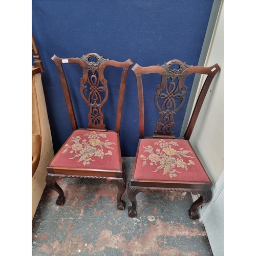 62B - A pair of Georgian style mahogany and tapestry upholstered dining chairs with ball and claw supports