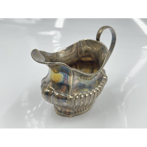 1241 - An Edwardian hallmarked Birmingham silver milk jug, dated 1902 - approx. gross weight 91 grams and 8... 