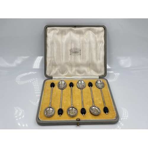 1242 - A set of six Hukin & Heath Ltd hallmarked Birmingham silver coffee bean spoons in Harrods London cas... 