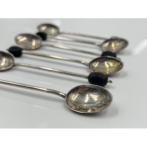 1242 - A set of six Hukin & Heath Ltd hallmarked Birmingham silver coffee bean spoons in Harrods London cas... 