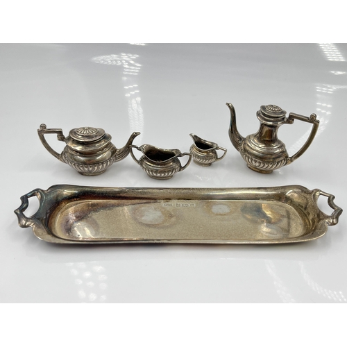 1251 - A cased Peter John Doherty hallmarked Birmingham silver five piece miniature tea/coffee service, dat... 