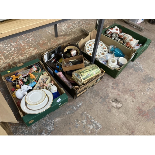 782 - Four boxes containing ceramics, horse brasses, Lorus quartz men's wristwatch, coins etc.