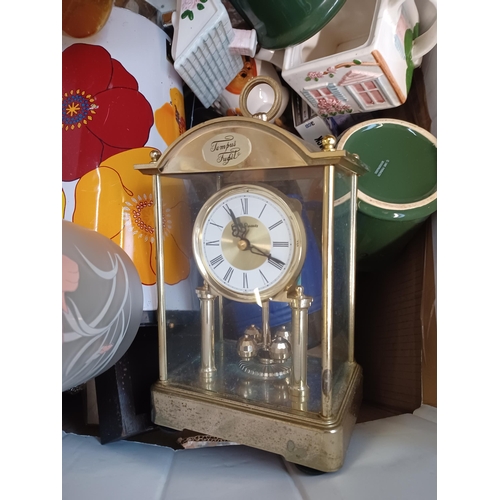 769 - A box containing house clearance items to include GEM quartz Tempest Fugit mantel clock, glassware, ... 