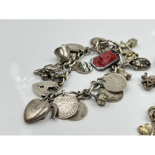 1085 - Two .925 silver charm bracelets - approx. gross weight 93.77 grams