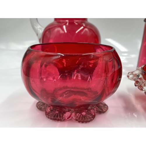 199 - Four pieces of Victorian cranberry glassware - largest approx. 15cm high