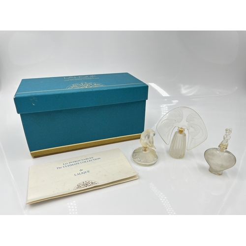 207 - A boxed Lalique The Ultimate Collection three piece scent bottle set