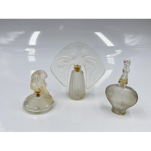 207 - A boxed Lalique The Ultimate Collection three piece scent bottle set