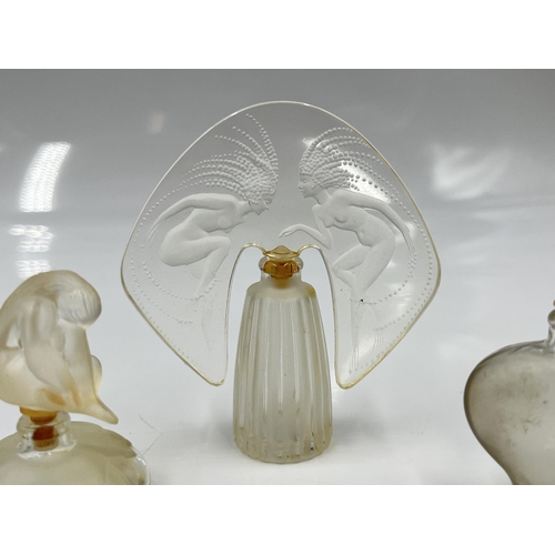 207 - A boxed Lalique The Ultimate Collection three piece scent bottle set