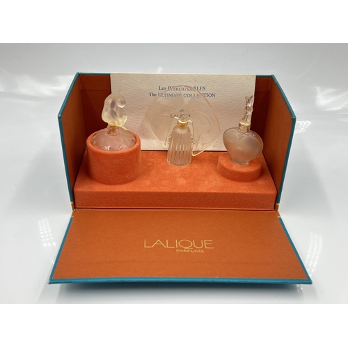 207 - A boxed Lalique The Ultimate Collection three piece scent bottle set