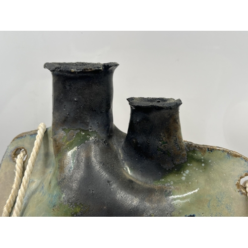 211 - A mid 20th century studio pottery wall hanging flask - approx. 29cm high x 24cm wide