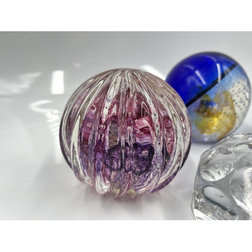 215 - Five studio glass paperweights, one Tutbury and four Caithness to include Nimbus limited edition 396... 