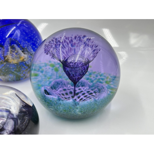 215 - Five studio glass paperweights, one Tutbury and four Caithness to include Nimbus limited edition 396... 