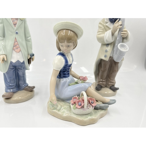 220 - Three Lladro figurines to include 