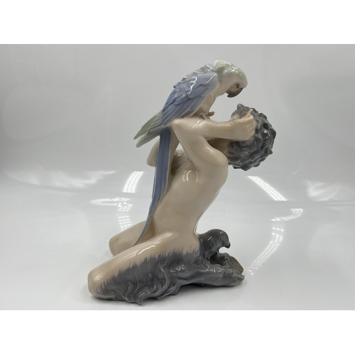 225 - A Royal Copenhagen Faun with Parrot figurine, model no. 752 - approx. 18cm high