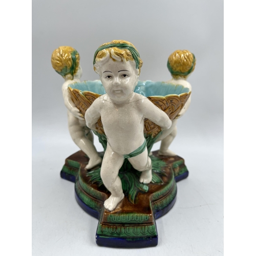 231 - A 19th century style Majolica triple cherub centre piece bowl - approx. 27cm high