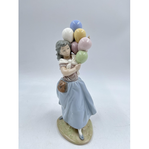 238 - A Lladro 'Balloon seller' figurine, model No. 5141 - 26cm high