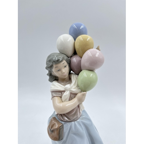 238 - A Lladro 'Balloon seller' figurine, model No. 5141 - 26cm high