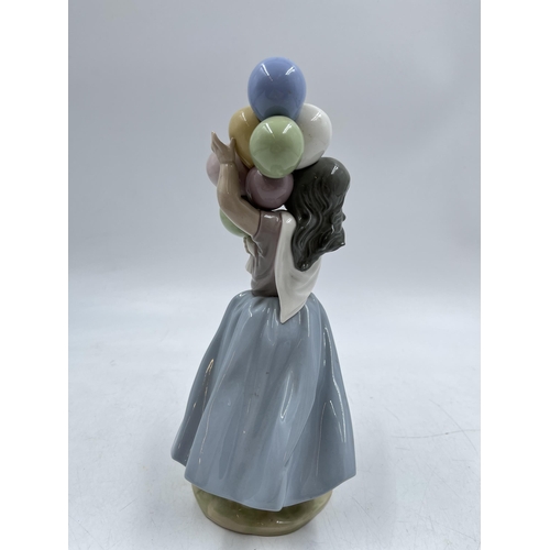 238 - A Lladro 'Balloon seller' figurine, model No. 5141 - 26cm high