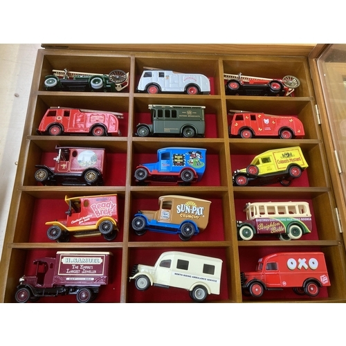 339 - Nine hardwood display cases containing a large collection of various diecast model vehicles