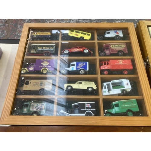 339 - Nine hardwood display cases containing a large collection of various diecast model vehicles