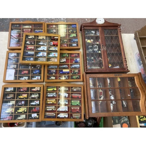 340 - Nine hardwood display cases containing a large collection of various diecast model vehicles