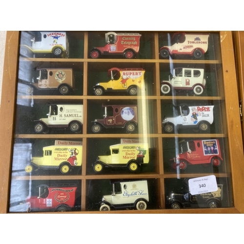 340 - Nine hardwood display cases containing a large collection of various diecast model vehicles