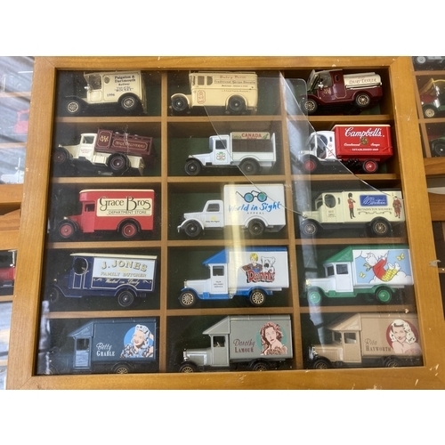 340 - Nine hardwood display cases containing a large collection of various diecast model vehicles