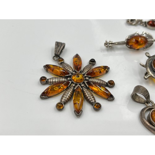 1094 - Eight pieces of .925 silver amber jewellery to include brooches, pendants etc. - approx. gross weigh... 