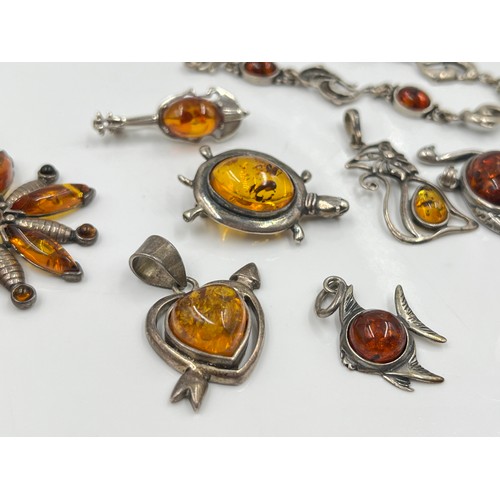 1094 - Eight pieces of .925 silver amber jewellery to include brooches, pendants etc. - approx. gross weigh... 