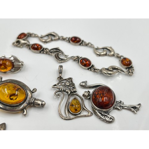 1094 - Eight pieces of .925 silver amber jewellery to include brooches, pendants etc. - approx. gross weigh... 