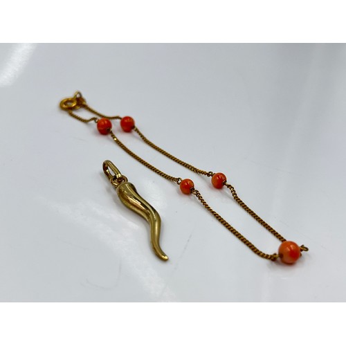 1130 - Two pieces of 9ct gold jewellery, one coral beaded bracelet and one pendant - approx. gross weight 2... 